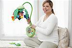 Pregnant Woman With Baby Toy