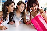 Girls Looking into Shopping Bag