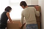 Couple with Boxes in New Home