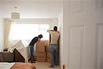 Couple with Boxes in New Home