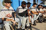 Baseball Players Sitting in Dugout