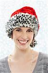 Portrait of Woman Wearing Leopard Print Santa Hat