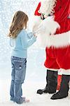 Santa Giving Present to Girl