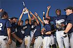 Baseball Team Cheering with Trophy