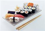 Assorted sushi on white platter