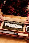 Preparing rolled sushi