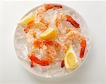 Shrimps with lemon on crushed ice