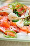 Salmon carpaccio with spring onions