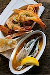 Marinated sardines and fried scampi