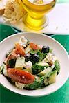 Greek salad with white bread and olive oil