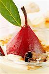 Pear in red wine with cinnamon in Madeira cream