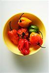 Various chili peppers in yellow bowl