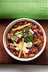 Chili con carne with cheese and sour cream