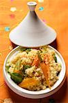 Couscous with carrots and oranges in tajine