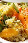 Couscous with carrots and oranges (close-up)