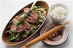 Duck breast on rice noodles with green asparagus, rice