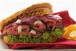 Roast beef and onion sandwich, crisps