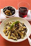Fusilli with sardines & basil, olives, glass of red wine