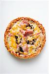 Mini-pizza with ham, mushrooms and cheese