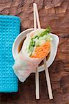 Vietnamese rice paper rolls with chopsticks and dip