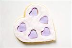 Heart-shaped biscuit with lilac and white icing