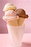 Strawberry, chocolate and vanilla ice cream in wafer cones