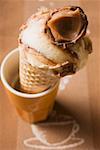 Caramel ice cream in wafer cone in a beaker