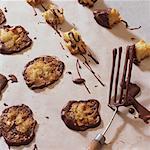 Almond thins & almond & candied peel clusters on baking parchment