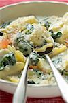 Pasta with spinach & cream sauce, diced tomatoes & Parmesan