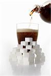 Cola & sugar cubes (picture symbolising high sugar content)