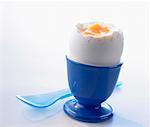 A breakfast egg in a blue eggcup