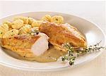 Fried chicken breast with thyme sauce and gnocchi