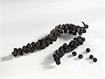 Bunches of black peppercorns