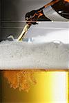 Pouring beer out of a bottle