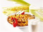 Cornflakes with fruit and glass of milk