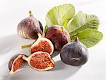 Three whole figs and one cut into pieces