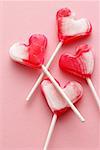 Four heart-shaped lollipops
