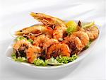 Shrimps with lettuce garnish in a dish