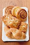 Assorted Danish pastries on a paper plate