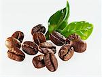 Roasted coffee beans with leaves