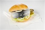 Herring roll with gherkin and onion