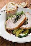 Loin of pork with herb stuffing on courgettes