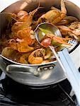 Crayfish stew in stew-pan on cooker