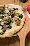 Pizza with tuna, chard and olives