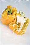 Yellow peppers, whole and halved