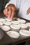 Arranging tart cases on baking tray