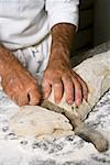 Making olive bread (dividing the dough into portions)