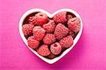 Raspberries in heart-shaped bowl