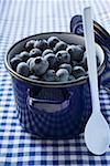 Fresh blueberries in blue pan