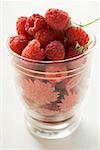 Fresh raspberries in a glass